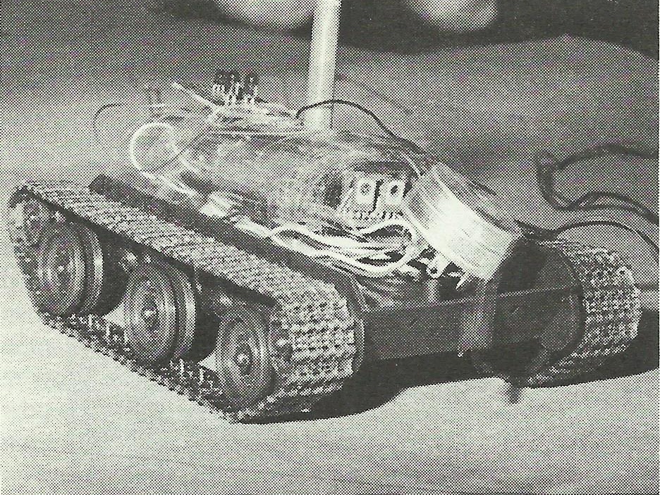 Rather than re-engineer the tank and power the tracks by stepping motors,
the controller monitored the DC motor feed and counted pulses on the motor feeddue
to the rotation of the commutator through the brushes.